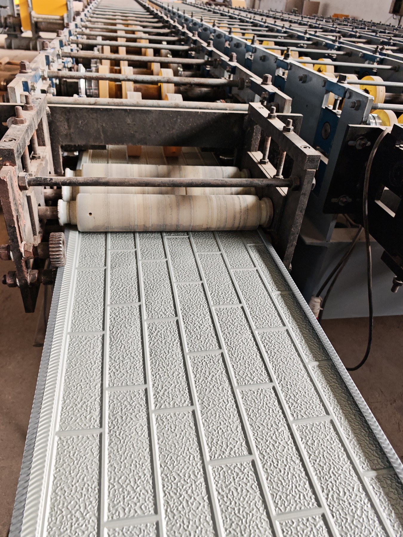 Metal sheet embossing process