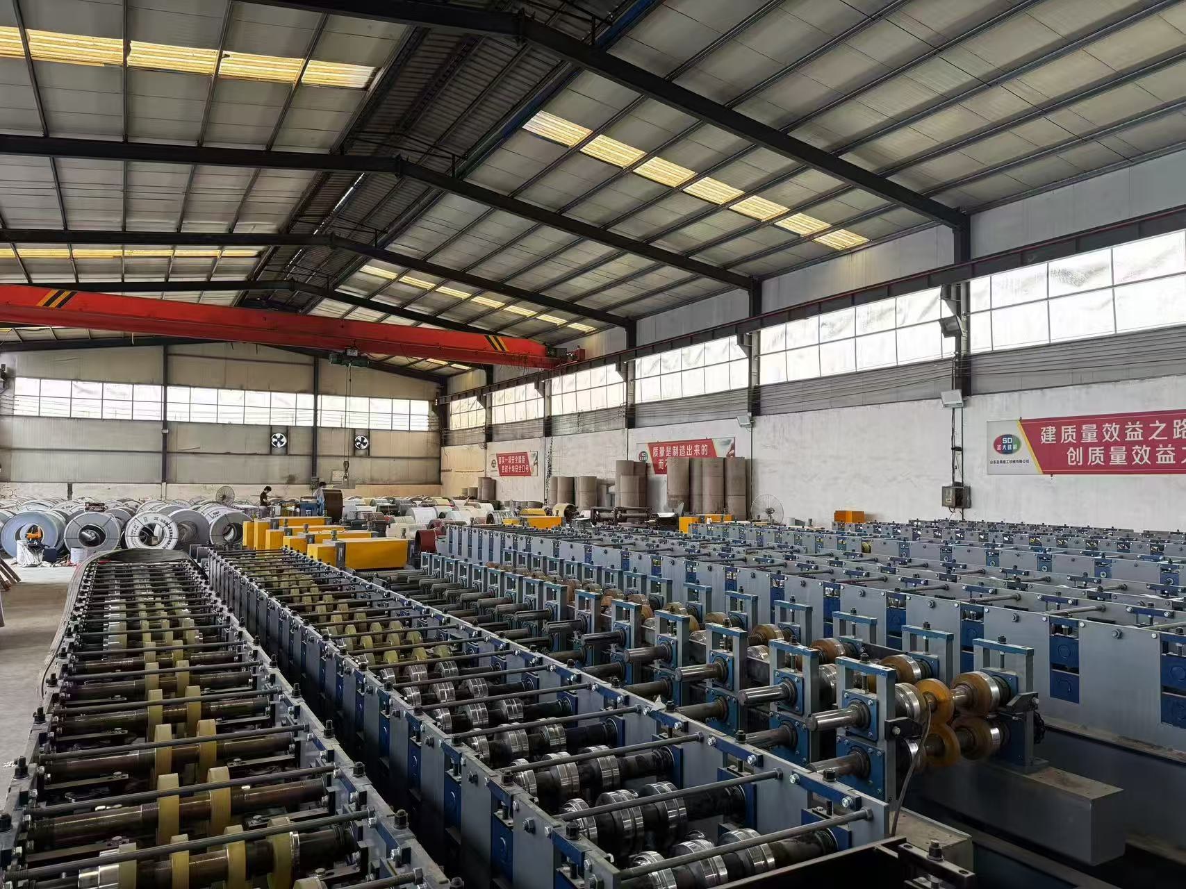 Wide view of wall panel forming lines inside the workshop