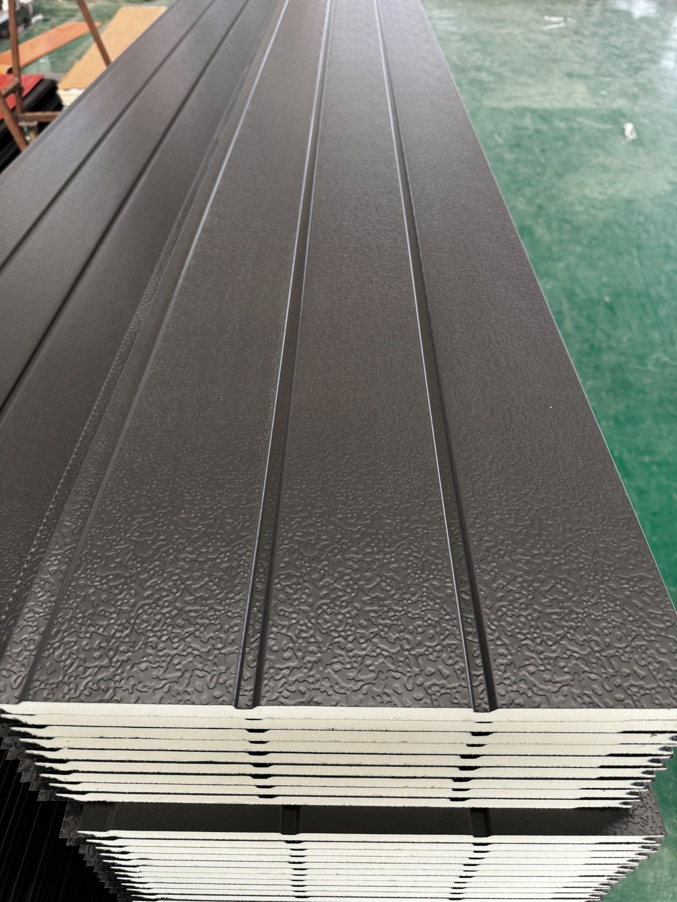 Uniform dark gray solid color metal wall panel