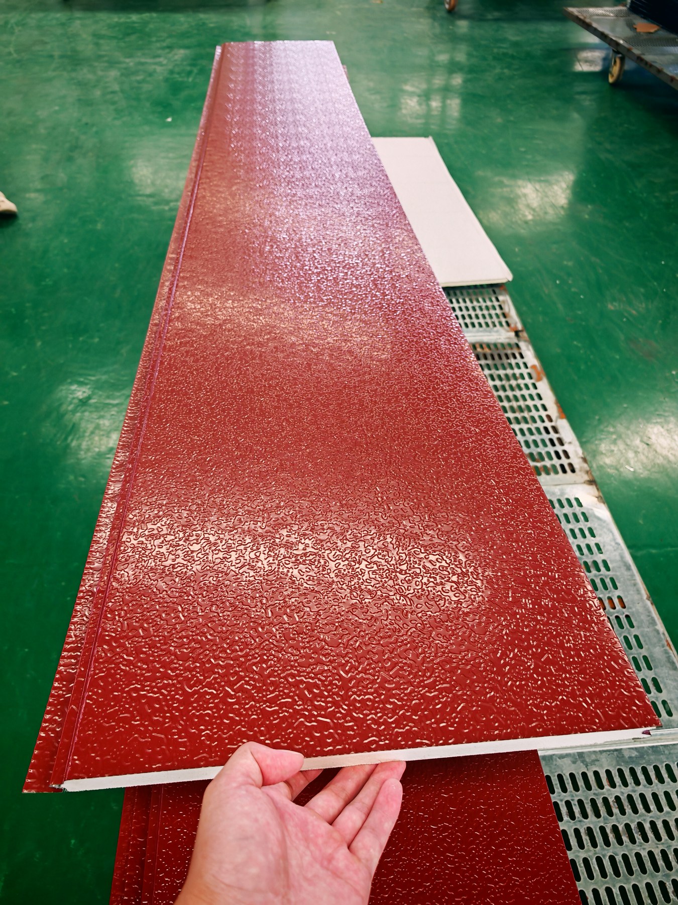 Red embossed wall panel surface